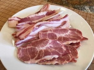 Slices of buckboard bacon
