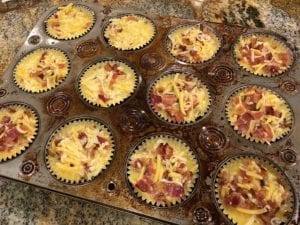 Egg mixture divided among 12 foil baking cups