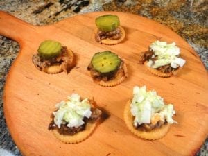 Cutting board loaded with barbecue cracker appetizers