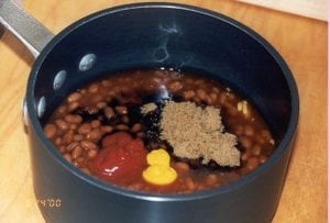 Adding ingredients to sauce pan