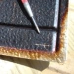 Marking the spot to drill with a center punch