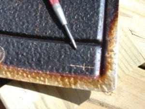 Marking the spot to drill with a center punch