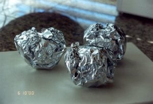 Apples wrapped in foil and ready for the cooker