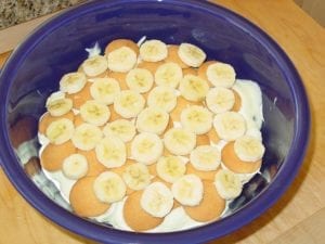 Layering wafers, bananas, and pudding