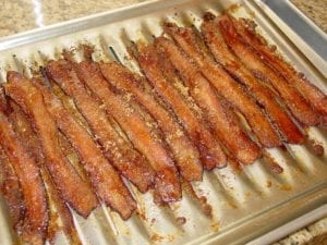 Pig candy, also known as candied bacon, comes out of the smoker