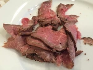 Thinly sliced cold pit beef ready to be reheated