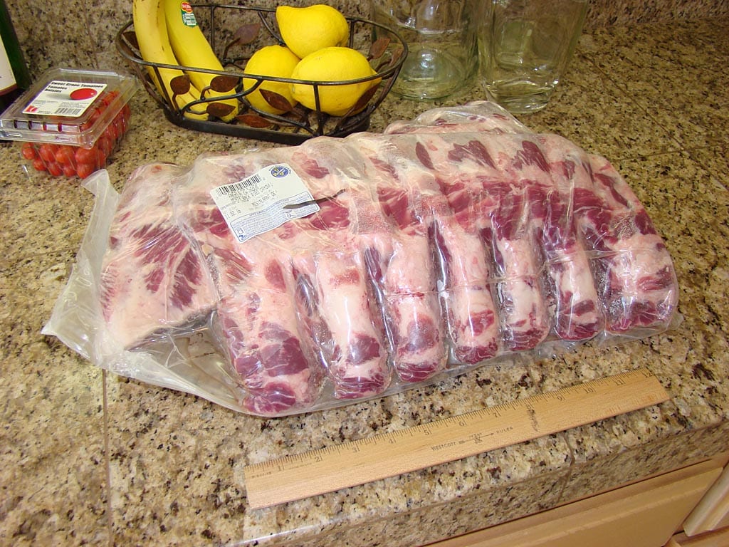 Three slabs of beef back ribs in Cryovac packaging