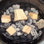 Wood chunks spread over hot coals