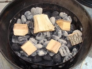 Wood chunks spread over hot coals