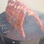 2 slabs of ribs on the top cooking grate