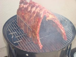 2 slabs of ribs on the top cooking grate