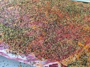 Close-up of coarse black pepper on short ribs