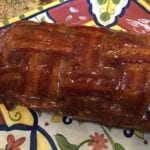 Breakfast bacon weave fatty on serving platter brushed with barbecue sauce