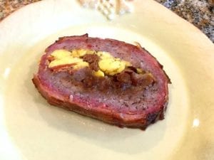 A slice of breakfast bacon weave fatty on a plate