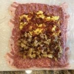 Stuffing placed on top of sausage layer