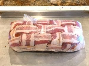 Breakfast bacon weave fatty wrapped in plastic wrap until ready to cook