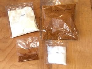 Pre-measure packets of chili spices, cayenne, salt, and masa flour