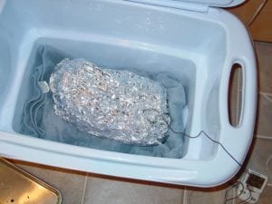 Brisket held at food-safe temperature in an empty cooler
