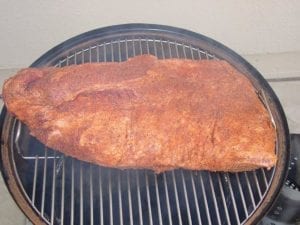 Brisket goes into the cooker