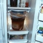 Large round food service container in refrigerator