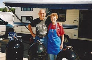 Mike Scrutchfield and Donna McClure of P.D.T. (Pretty Damn Tasty, another epic WSM team from the 1990s) pose with Weber smokers at the Great American Barbecue in Kansas City, Memorial Day Weekend 2005.