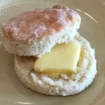 Close-up of a sour cream biscuit with butter