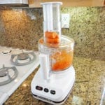 Grating carrots in a food processor