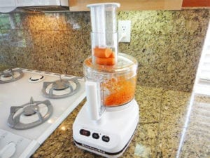 Grating carrots in a food processor