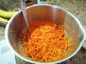 Grated carrots tossed with lemon juice