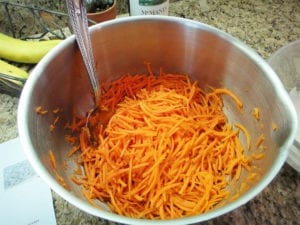 Grated carrots tossed with lemon juice