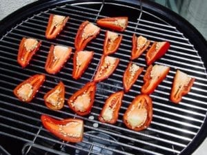 Halved jalapeños going into the WSM