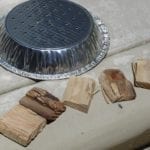 Perforated pie tin and smoke wood
