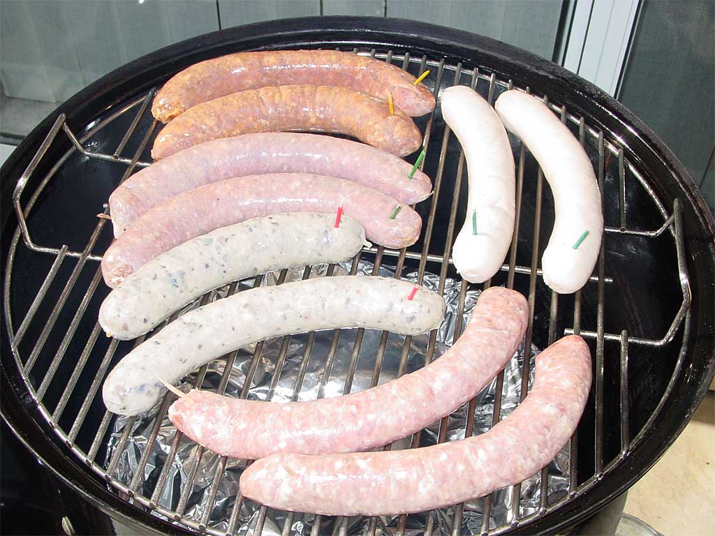 Fresh sausages go into the cooker on the top grate