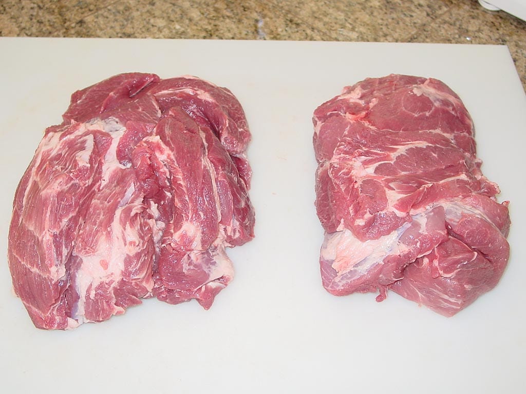 Trimmed pork butts ready to apply cure