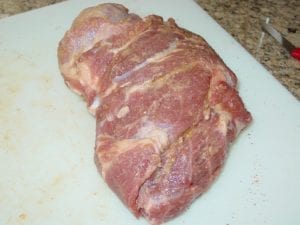 Pork butt after cure is applied