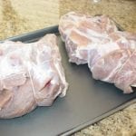 Pork butts tied after soaking, rinsing, and drying