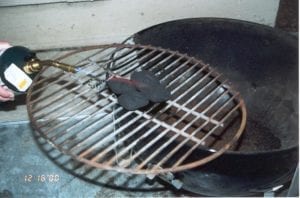 Lighting 4 briquettes with a propane torch