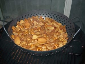 Chex party mix made in the Weber Smokey Mountain Cooker
