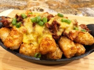 Totchos with leftover chopped brisket in barbecue sauce