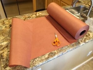 Preparing pink butcher paper