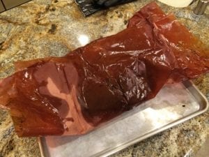 Brisket flat resting in butcher paper at room temp