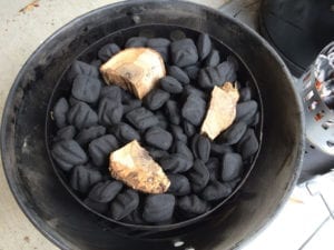 Unlit Kingsford charcoal with pecan chunks