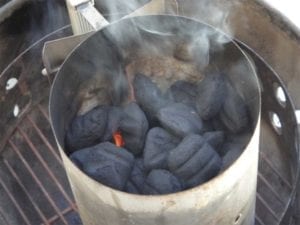 Lighting 3/4 of a chimney starter of Kingsford