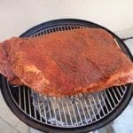 14+ pound brisket shoe-horned between top grate handles