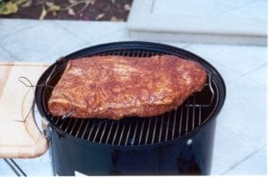 Brisket on top cooking grate