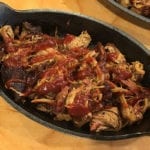 Pulled pork drizzled with barbecue sauce