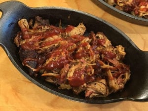 Pulled pork drizzled with barbecue sauce
