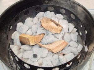 Charcoal ready to cook and smoke wood added