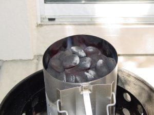 Flames licking at coals at top of chimney