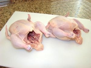 Two whole chickens, ready to be rubbed